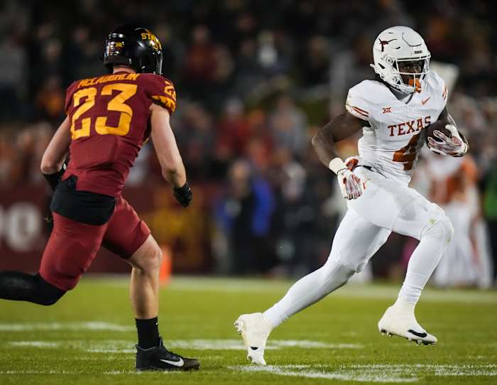 Texas running back CJ Baxter (4) carries the ball in the first half of the Longhorns' game against the Cyclones at Jack Trice Stadium in Ames, Iowa, Saturday, Nov. 18, 2023